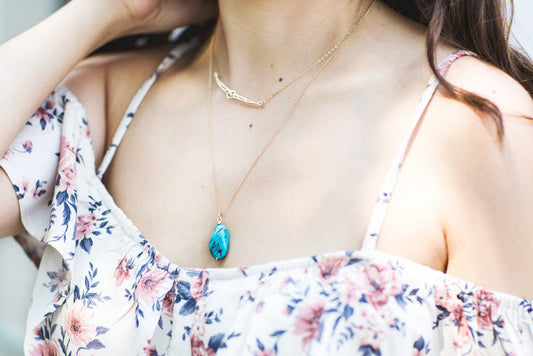 Turquoise stone pendant on delicate gold chain, stylish summer necklace worn with floral dress
